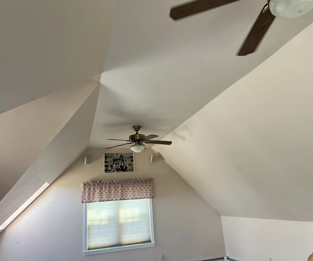 Vaulted attic room insulated and finished with drywall by DeFaria Construction