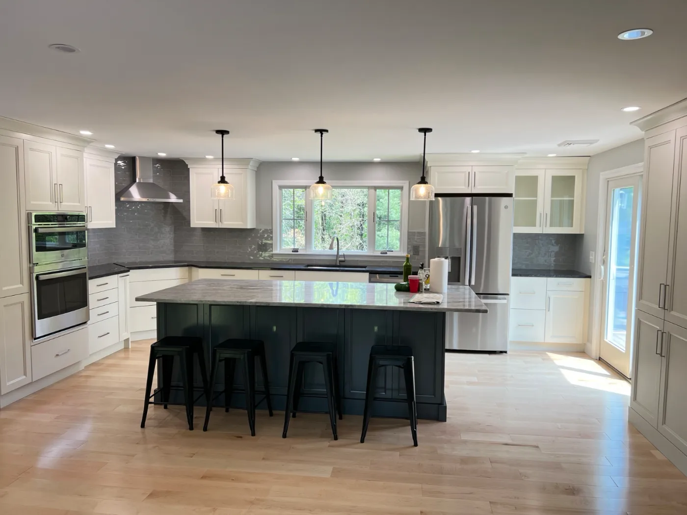 Kitchen remodel with large island by DeFaria Construction