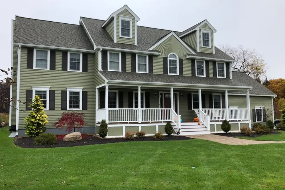 Colonial home exterior with fresh paint and new door and window trims, Westford MA